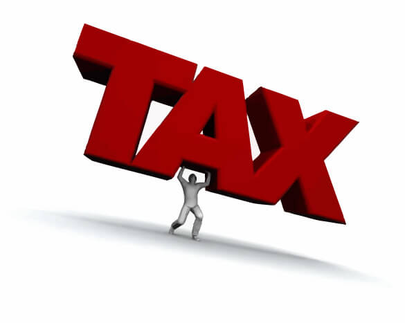 Man Carrying Big Letters That Spell Tax