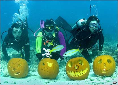 Three Scuba Divers and Four Pumpkins