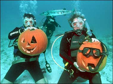 Two Scuba Divers and Two Pumpkins